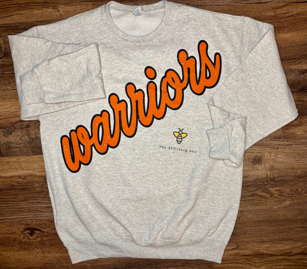 Warriors script on sweatshirt